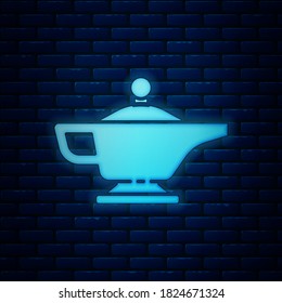 Glowing neon Magic lamp or Aladdin lamp icon isolated on brick wall background. Spiritual lamp for wish.  Vector Illustration