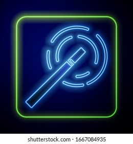 Glowing neon Magic wand icon isolated on blue background. Star shape magic accessory. Magical power.  Vector Illustration