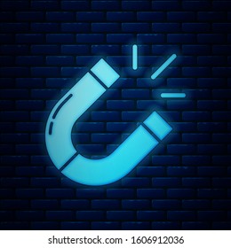 Glowing neon Magnet icon isolated on brick wall background. Horseshoe magnet, magnetism, magnetize, attraction.  Vector Illustration