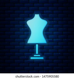 Glowing neon Mannequin icon isolated on brick wall background. Tailor dummy.  Vector Illustration