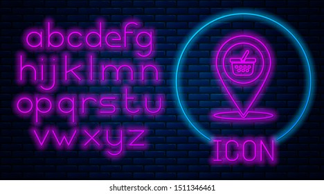 Glowing neon Map pointer with shopping basket icon isolated on brick wall background. Pin point shop and shopping. Supermarket basket symbol. Neon light alphabet. Vector Illustration
