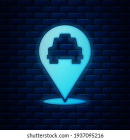 Glowing neon Map pointer with taxi icon isolated on brick wall background. Location symbol.  Vector