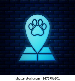 Glowing neon Map pointer with veterinary medicine hospital, clinic or pet shop for animals icon isolated on brick wall background. Veterinarian clinic.  Vector Illustration