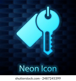 Glowing neon Marked key icon isolated on brick wall background.  Vector