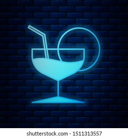 Glowing neon Martini glass icon isolated on brick wall background. Cocktail icon. Wine glass icon.  Vector Illustration
