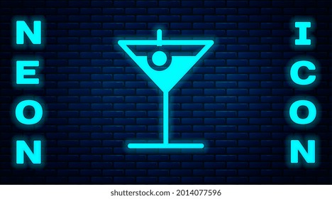 Glowing neon Martini glass icon isolated on brick wall background. Cocktail icon. Wine glass icon.  Vector Illustration