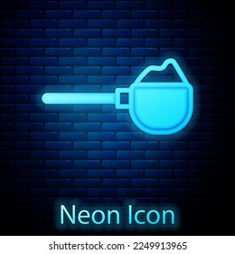 Glowing neon Measuring cup with flour icon isolated on brick wall background. Baking Ingredients. Healthy organic food. Dough cooking.  Vector