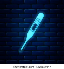 Glowing neon Medical digital thermometer for medical examination icon isolated on brick wall background.  Vector Illustration