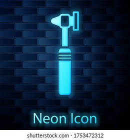 Glowing neon Medical otoscope tool icon isolated on brick wall background. Medical instrument. Vector Illustration