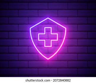 Glowing Neon Medical Shield With Cross Icon Isolated On Brick Wall Background. Health Protection Concept. Safety Badge Icon. Privacy Banner. Security Label. Vector Illustration.