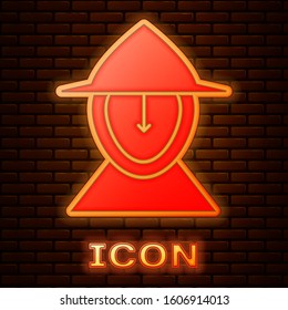 Glowing neon Medieval iron helmet for head protection icon isolated on brick wall background.  Vector Illustration
