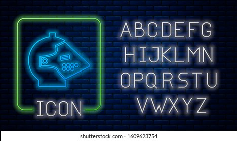 Glowing neon Medieval iron helmet for head protection icon isolated on brick wall background. Neon light alphabet. Vector Illustration