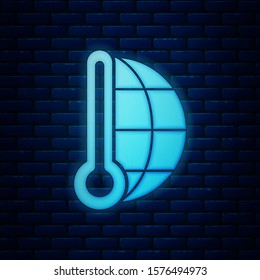 Glowing neon Meteorology thermometer measuring heat and cold icon isolated on brick wall background. Thermometer equipment showing hot or cold weather.  Vector Illustration