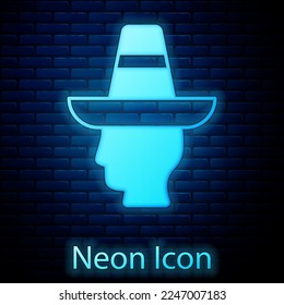 Glowing neon Mexican man wearing sombrero icon isolated on brick wall background. Hispanic man with a mustache.  Vector