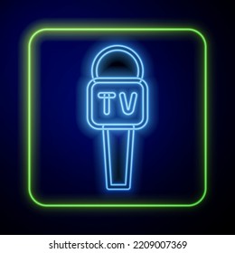 Glowing neon Microphone icon isolated on blue background. On air radio mic microphone. Speaker sign.  Vector