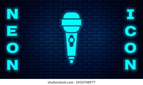 Glowing neon Microphone icon isolated on brick wall background. On air radio mic microphone. Speaker sign.  Vector Illustration