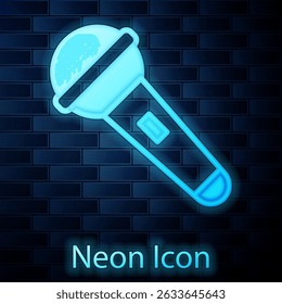Glowing neon Microphone icon isolated on brick wall background. On air radio mic microphone. Speaker sign.  Vector