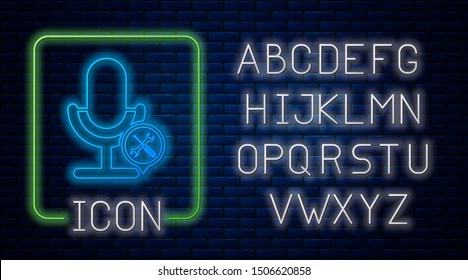Glowing neon Microphone with screwdriver and wrench icon isolated on brick wall background.  Neon light alphabet. Vector Illustration