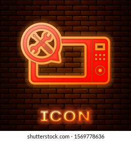 Glowing neon Microwave oven with screwdriver and wrench icon isolated on brick wall background. Adjusting, service, setting, maintenance, repair, fixing.  Vector Illustration