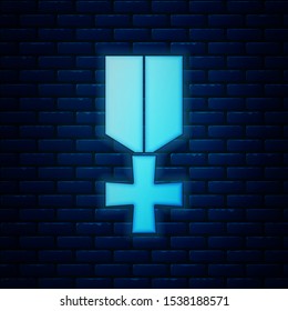 Glowing neon Military reward medal icon isolated on brick wall background. Army sign.  Vector Illustration