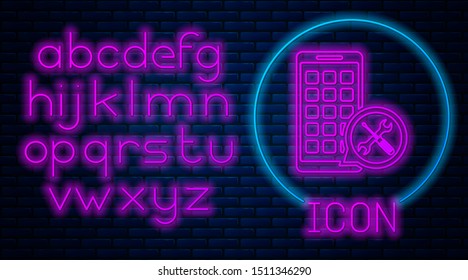 Glowing neon Mobile Apps with screwdriver and wrench icon isolated on brick wall background. Adjusting, service, setting, maintenance, repair, fixing. Neon light alphabet. Vector Illustration