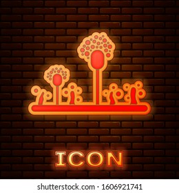 Glowing neon Mold icon isolated on brick wall background.  Vector Illustration