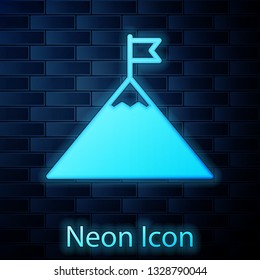 Glowing neon Mountains and flag on top icon isolated on brick wall background. Symbol of victory or success concept. Vector Illustration