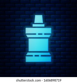 Glowing neon Mouthwash plastic bottle icon isolated on brick wall background. Liquid for rinsing mouth. Oralcare equipment.  Vector Illustration