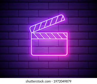 Glowing neon Movie clapper icon isolated on brick wall background. Film clapper board icon. Clapperboard sign. Cinema production or media industry concept. Vector Illustration.