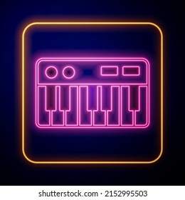Glowing neon Music synthesizer icon isolated on black background. Electronic piano.  Vector