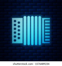 Glowing neon Musical instrument accordion icon isolated on brick wall background. Classical bayan, harmonic.  Vector Illustration