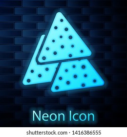 Glowing neon Nachos icon isolated on brick wall background. Tortilla chips or nachos tortillas. Traditional mexican fast food. Vector Illustration