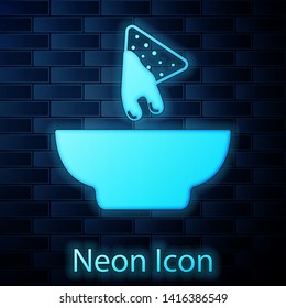 Glowing neon Nachos in plate icon isolated on brick wall background. Tortilla chips or nachos tortillas. Traditional mexican fast food. Vector Illustration