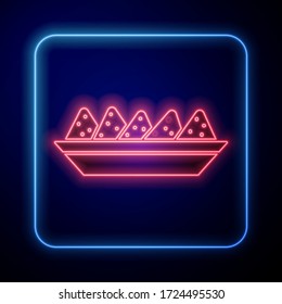 Glowing neon Nachos in plate icon isolated on blue background. Tortilla chips or nachos tortillas. Traditional mexican fast food menu.  Vector Illustration