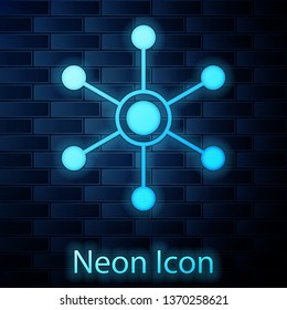 Glowing neon Network icon isolated on brick wall background. Global network connection. Global technology or social network. Connecting dots and lines. Vector Illustration