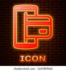 Glowing neon NFC Payment icon isolated on brick wall background. Mobile payment. NFC smartphone concept. Transfer icon.  Vector Illustration