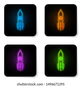Glowing neon Nuclear rocket icon isolated on white background. Rocket bomb flies down. Black square button. Vector Illustration