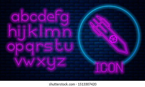 Glowing neon Nuclear rocket icon isolated on brick wall background. Rocket bomb flies down. Neon light alphabet. Vector Illustration