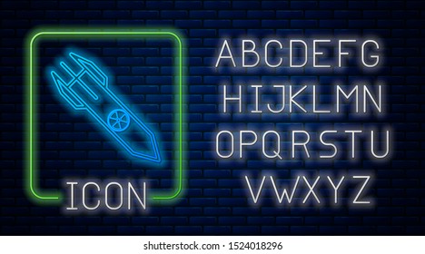 Glowing neon Nuclear rocket icon isolated on brick wall background. Rocket bomb flies down. Neon light alphabet. Vector Illustration