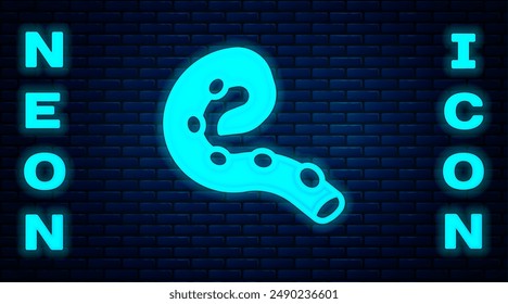 Glowing neon Octopus of tentacle icon isolated on brick wall background.  Vector