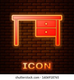 Glowing neon Office desk icon isolated on brick wall background.  Vector Illustration