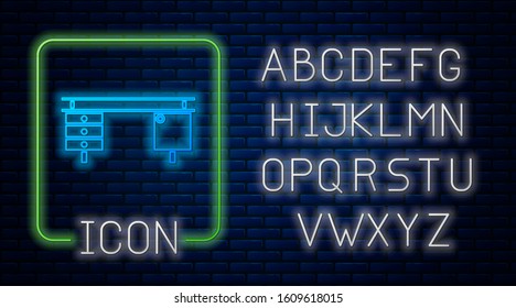 Glowing neon Office desk icon isolated on brick wall background. Neon light alphabet. Vector Illustration