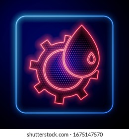 Glowing neon Oil and gas industrial factory building icon isolated on blue background.  Vector Illustration