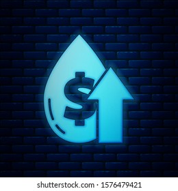 Glowing neon Oil price increase icon isolated on brick wall background. Oil industry crisis concept.  Vector Illustration