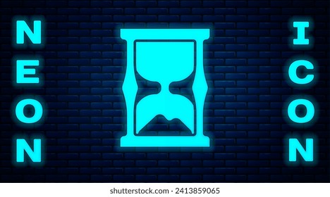 Glowing neon Old hourglass with flowing sand icon isolated on brick wall background. Sand clock sign. Business and time management concept.  Vector