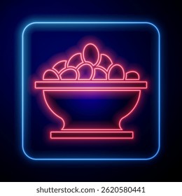 Glowing neon Olives in bowl icon isolated on black background.  Vector