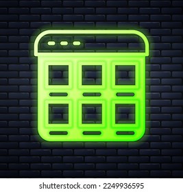 Glowing neon Online shopping on screen icon isolated on brick wall background. Concept e-commerce, e-business, online business marketing.  Vector