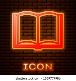 Glowing neon Open book icon isolated on brick wall background.  Vector Illustration