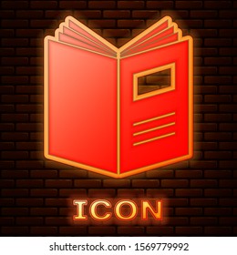 Glowing neon Open book icon isolated on brick wall background.  Vector Illustration