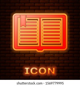 Glowing neon Open book icon isolated on brick wall background.  Vector Illustration
